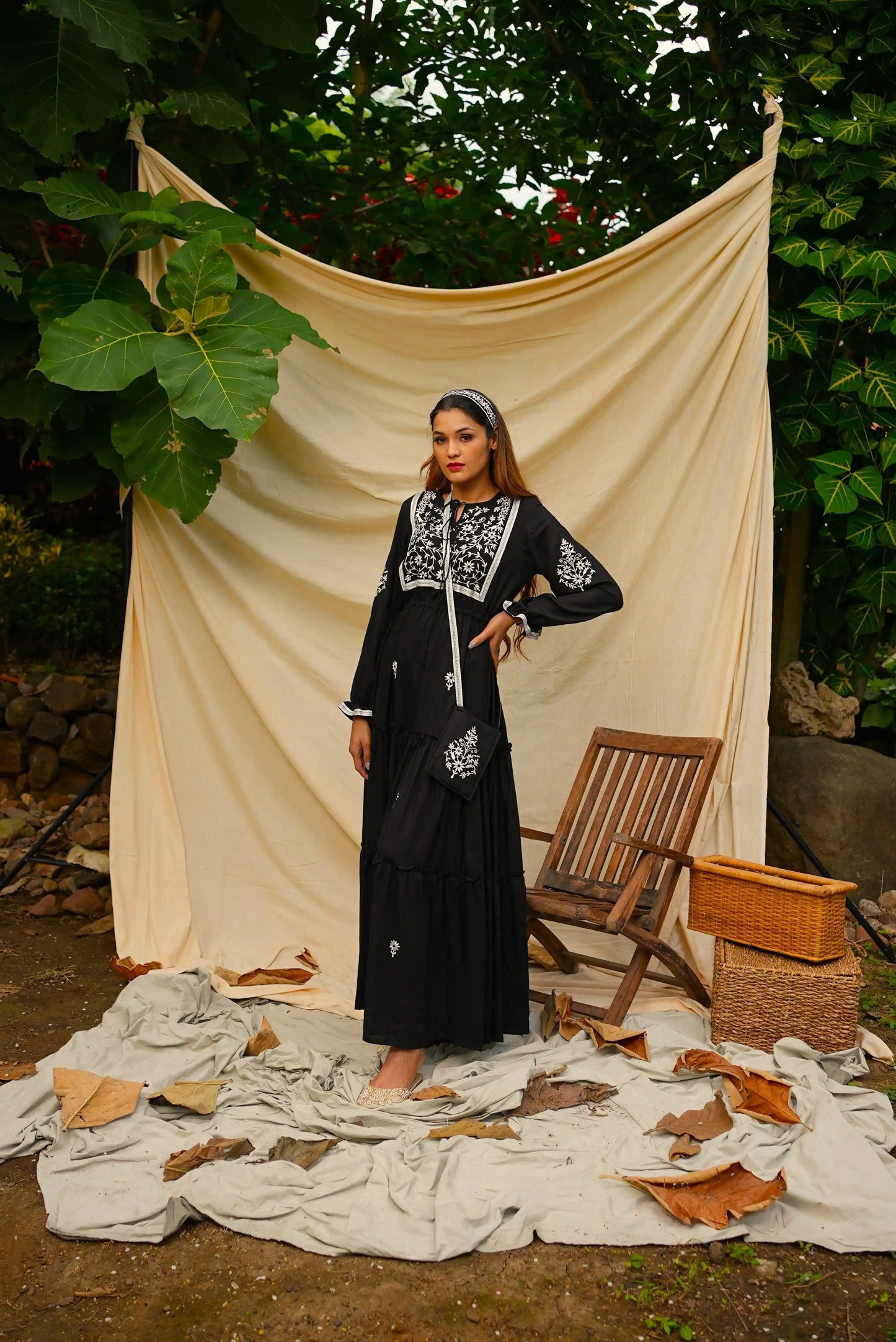 Ankle length embroidered Black tiered dress.