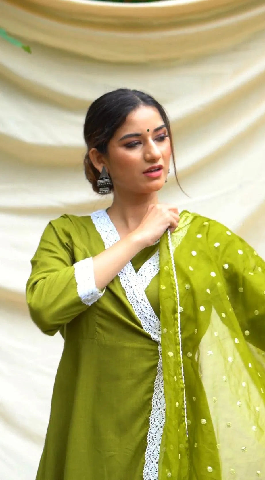 Green Anghrakha set with dupatta.
