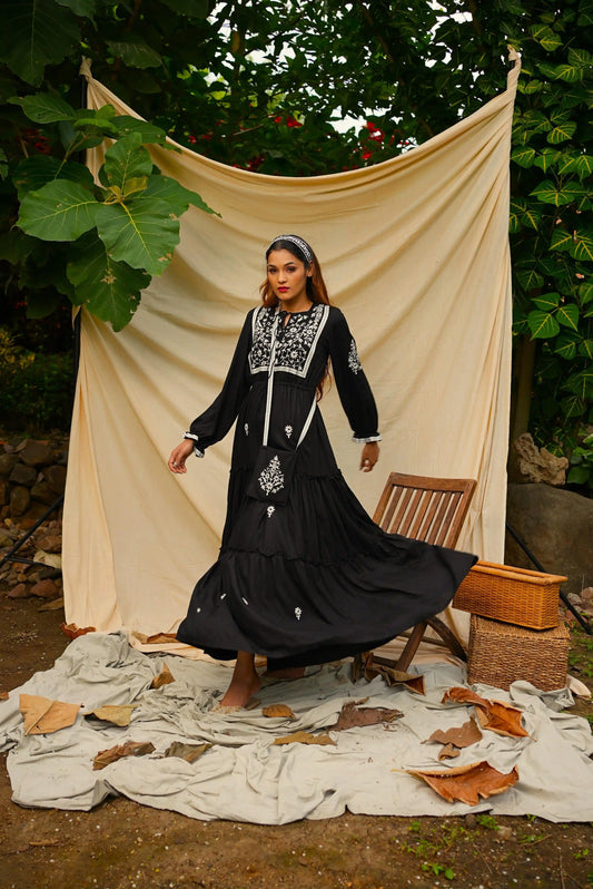 Ankle length embroidered Black tiered dress.